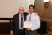 Dr. Nagib Callaos, General Chair, giving Mr. Leonard Cruz a certificate of appreciation for volunteering time and effort to make an additional presentation for Interdisciplinary Communication.
